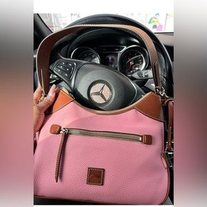 Pink Dooney and Bourke bag. New! Hobo with brown leather trim. NWT
